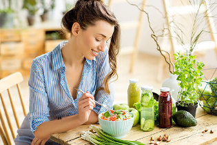 a girl eating a salad
