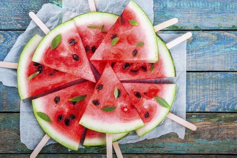 Sliced ​​watermelon on sticks for a snack on a watermelon diet
